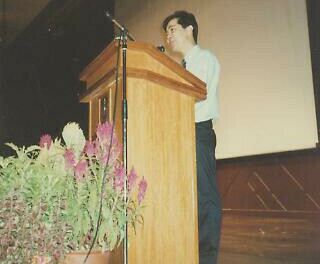 At the podium speaking about At the podium speaking about
